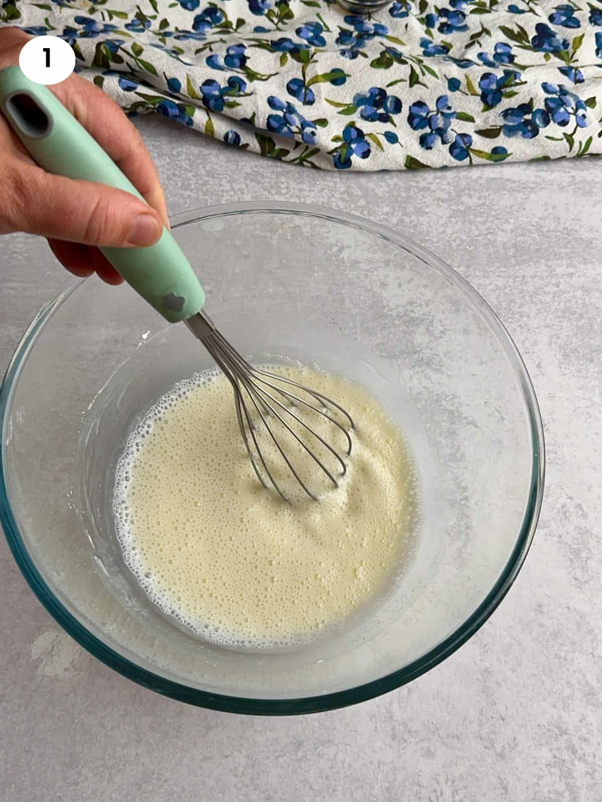 Mixing the cornstarch with sugar and milk in a bowl.