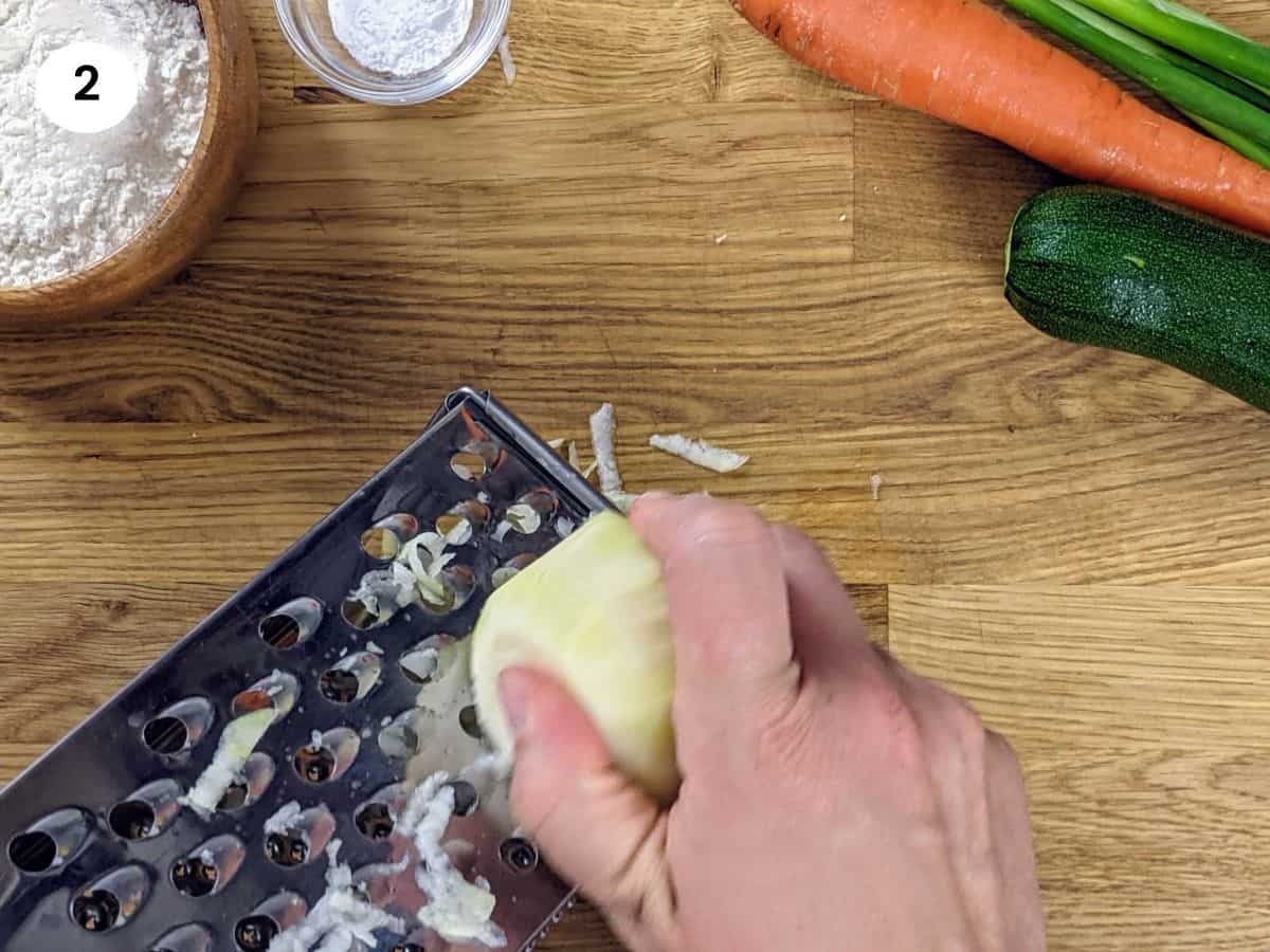 Grating the kohlrabi.