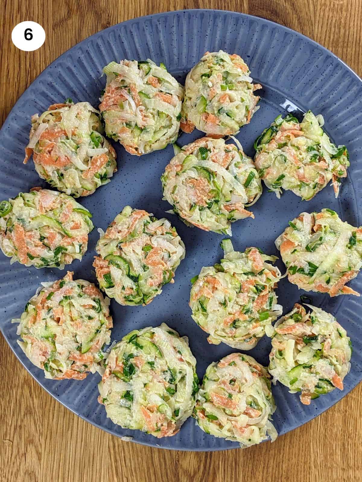 Shaped kohlrabi fritters on a plate.