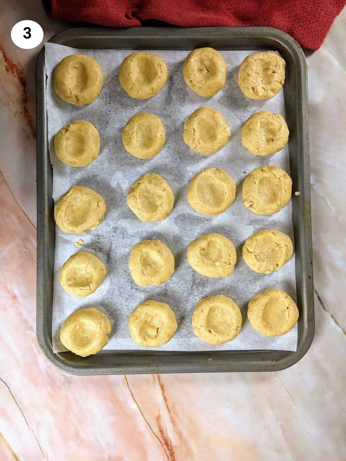 Baking tray with kourabiedes ready for the oven.