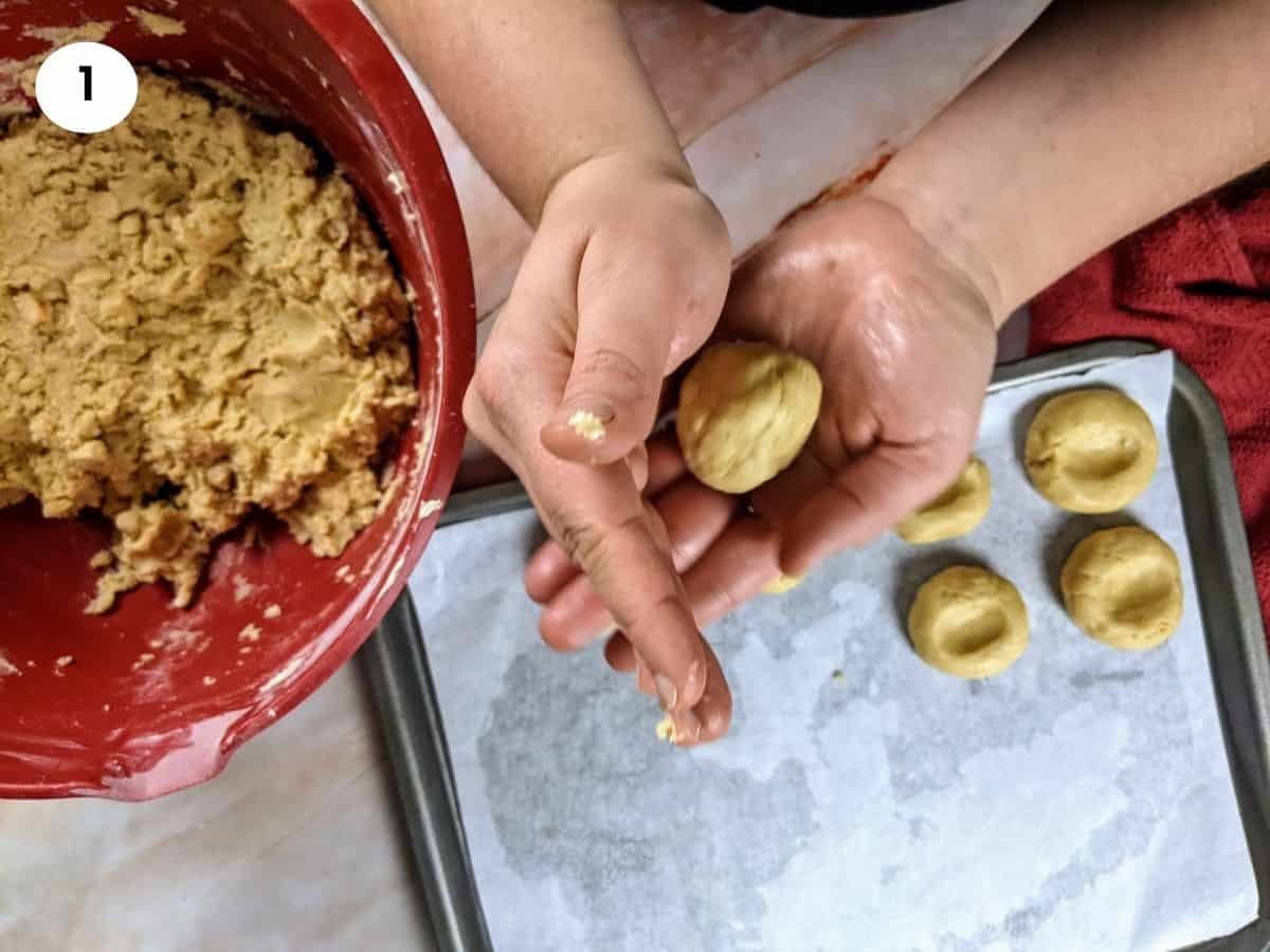 Shaping a ball of dough into a greek butter cookie