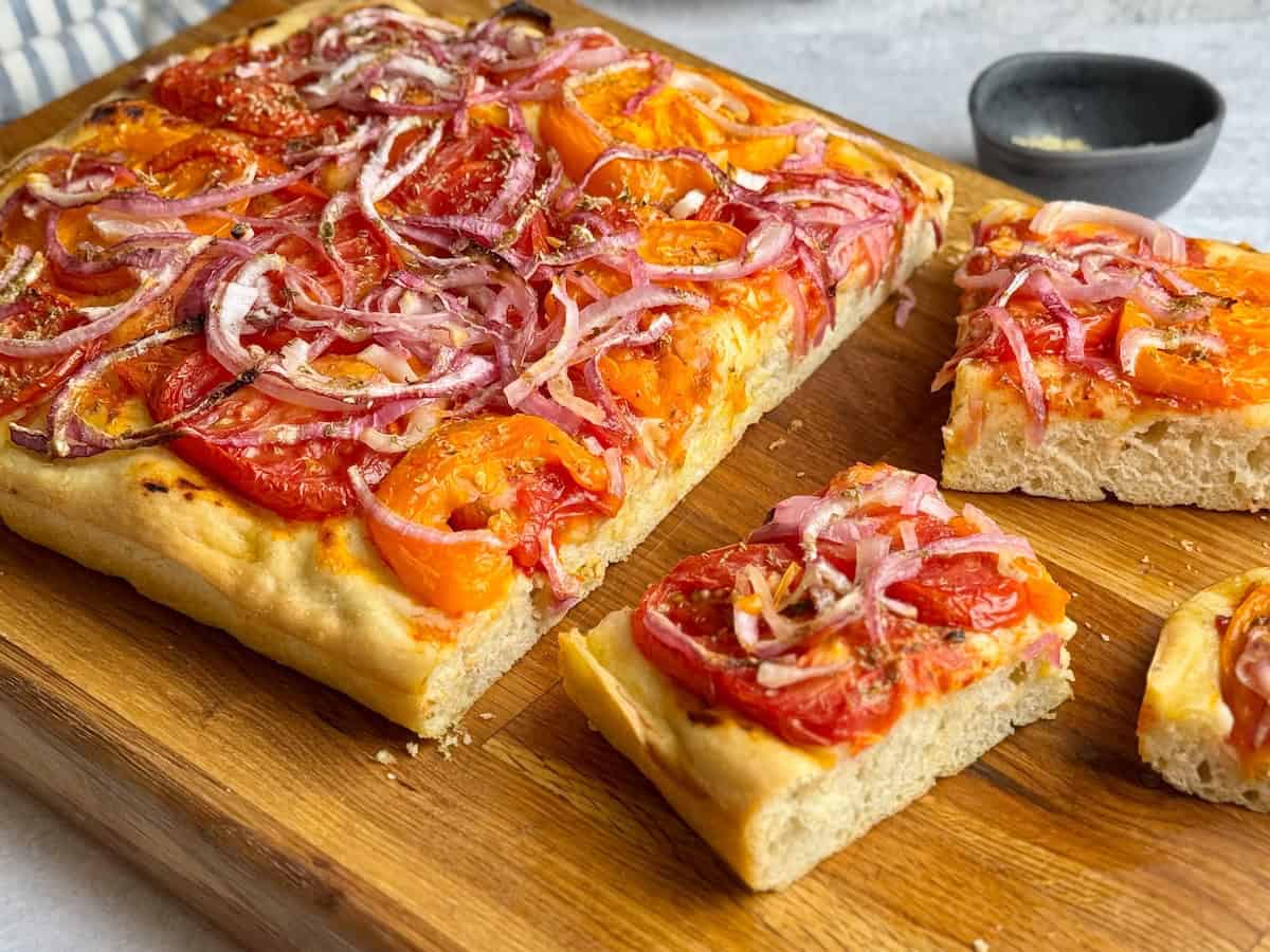 Ladenia flatbread on a wooden board.