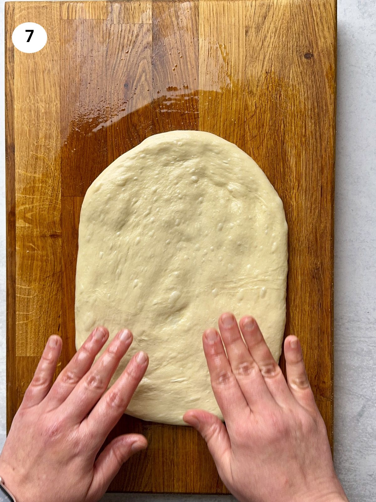 Stretching and folding the dough.