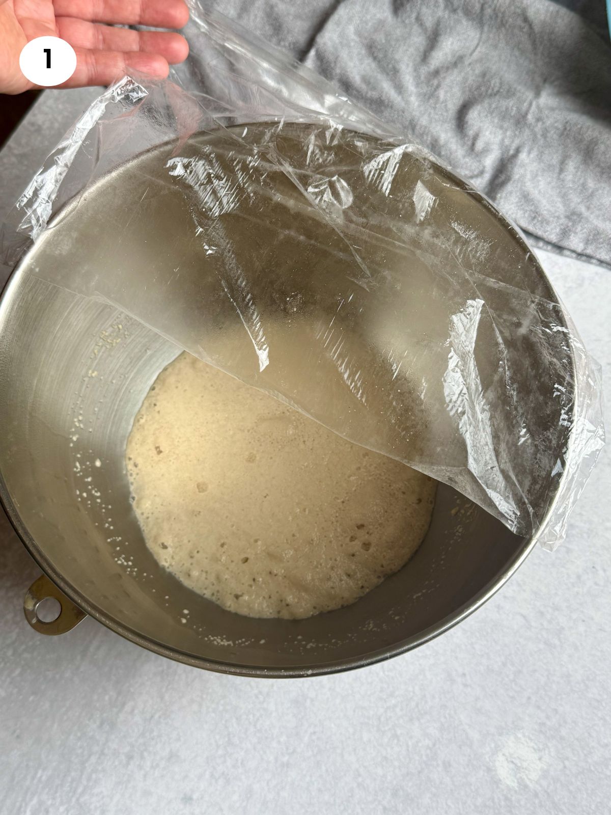 Yeast mixture after it has rested with foam on the surface.