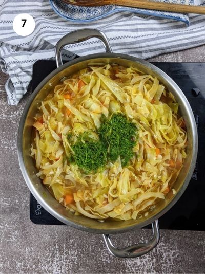 Adding the fresh dill and lemon juice to the pot.