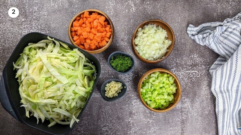 Chopped vegetables ready to be added to the pot for greek cabbage and rice stew.