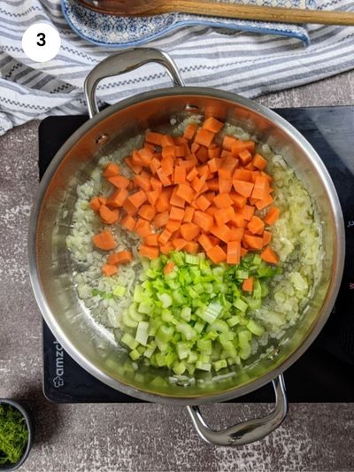 Saute the vegetables and add spices before the cabbage and rice.