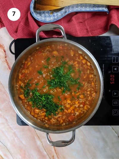 Adding the chopped parsley.