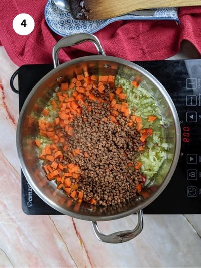 Cooking the lentils and vegetables before adding the pasta.