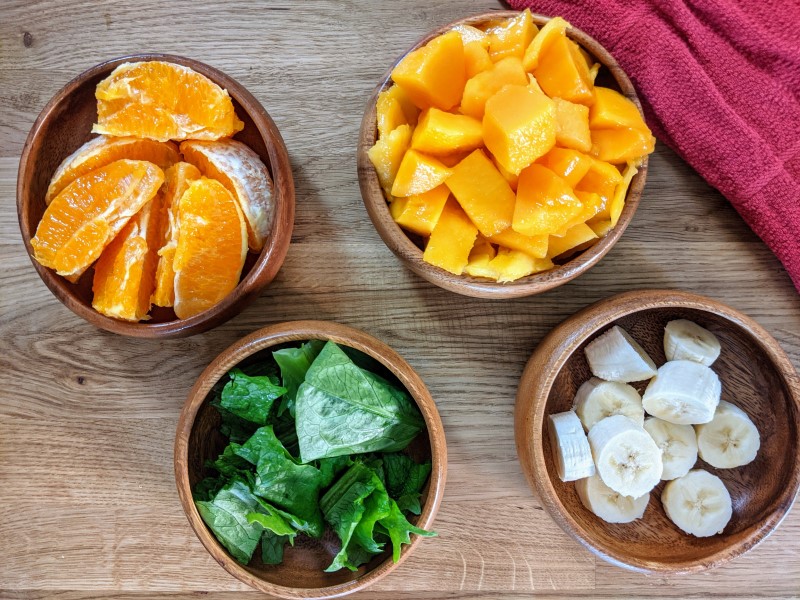 Chopped ingredients for mango & orange smoothie.