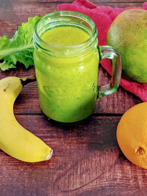 Mango & Orange Smoothie served in a glass Mango & Orange Smoothie served in a glass