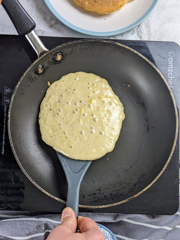 Pancake with bubbles ready to flip.