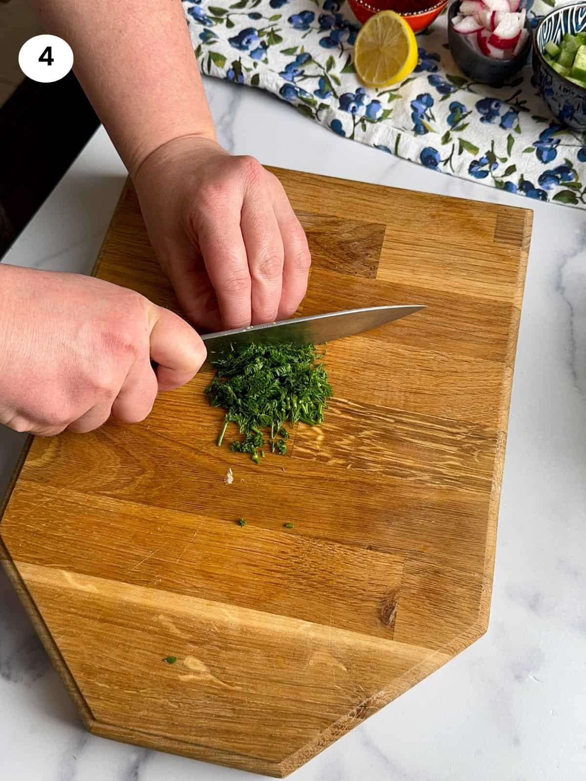 Chopping the fresh dill.