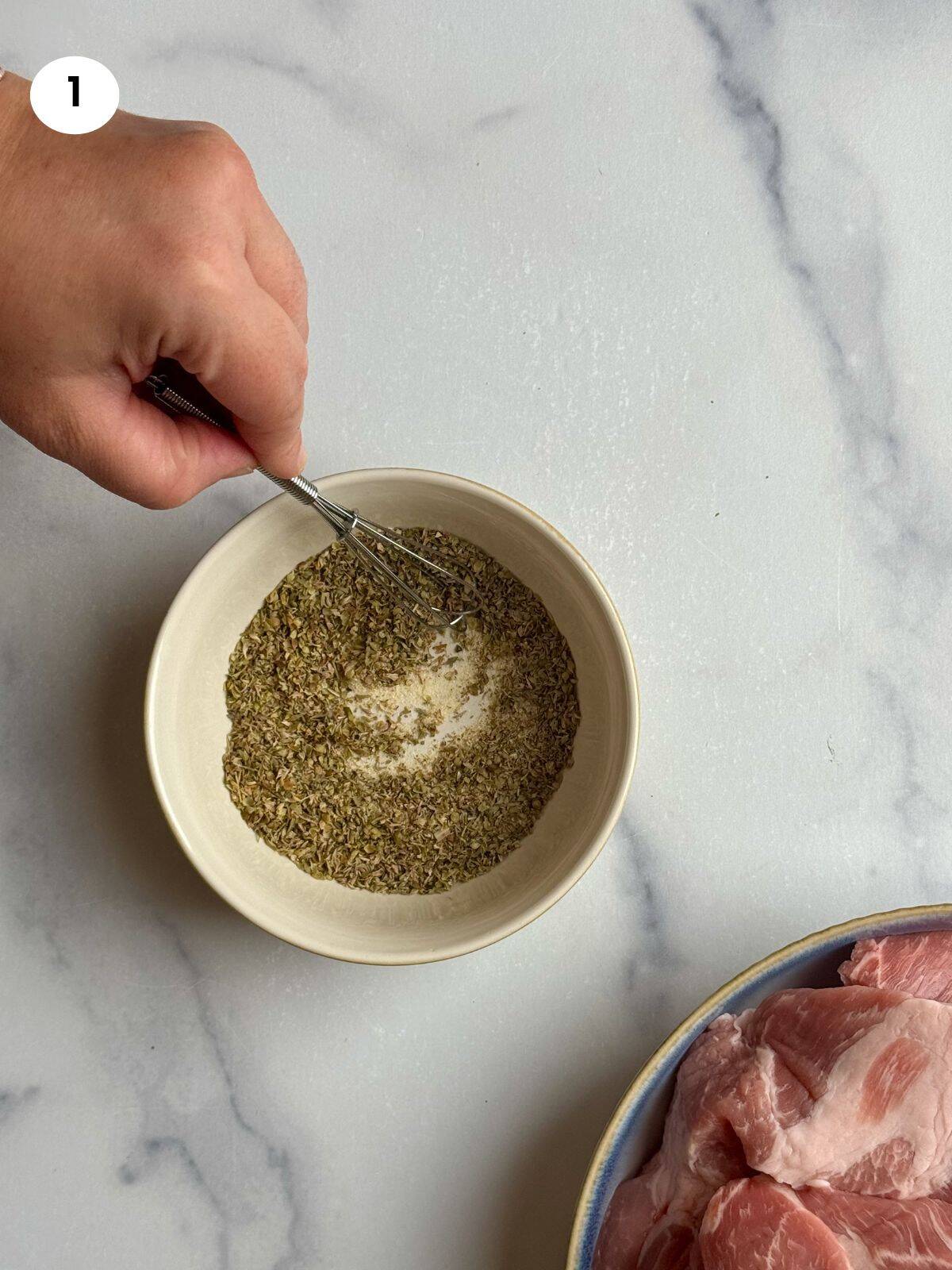 Mixing the dried herbs and seasoning.