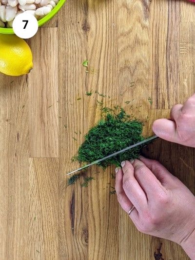Cutting the dill finely