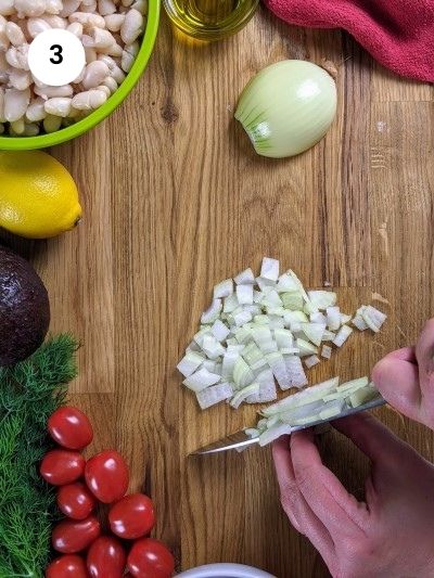 Cutting the onion into cubes.