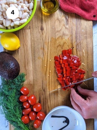 Cutting the roasted peppers.