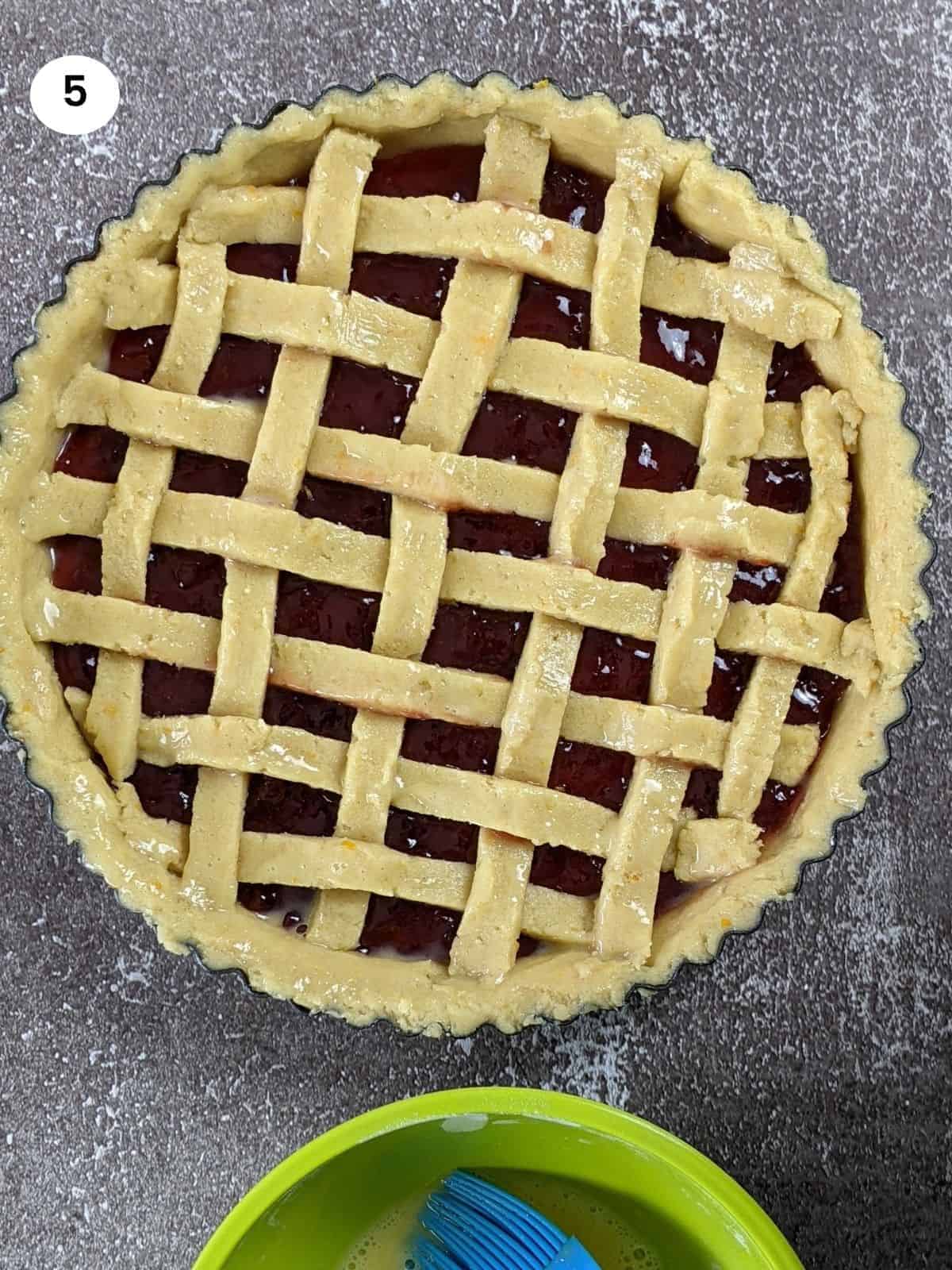 Adding the bottom layer to the tart tin.