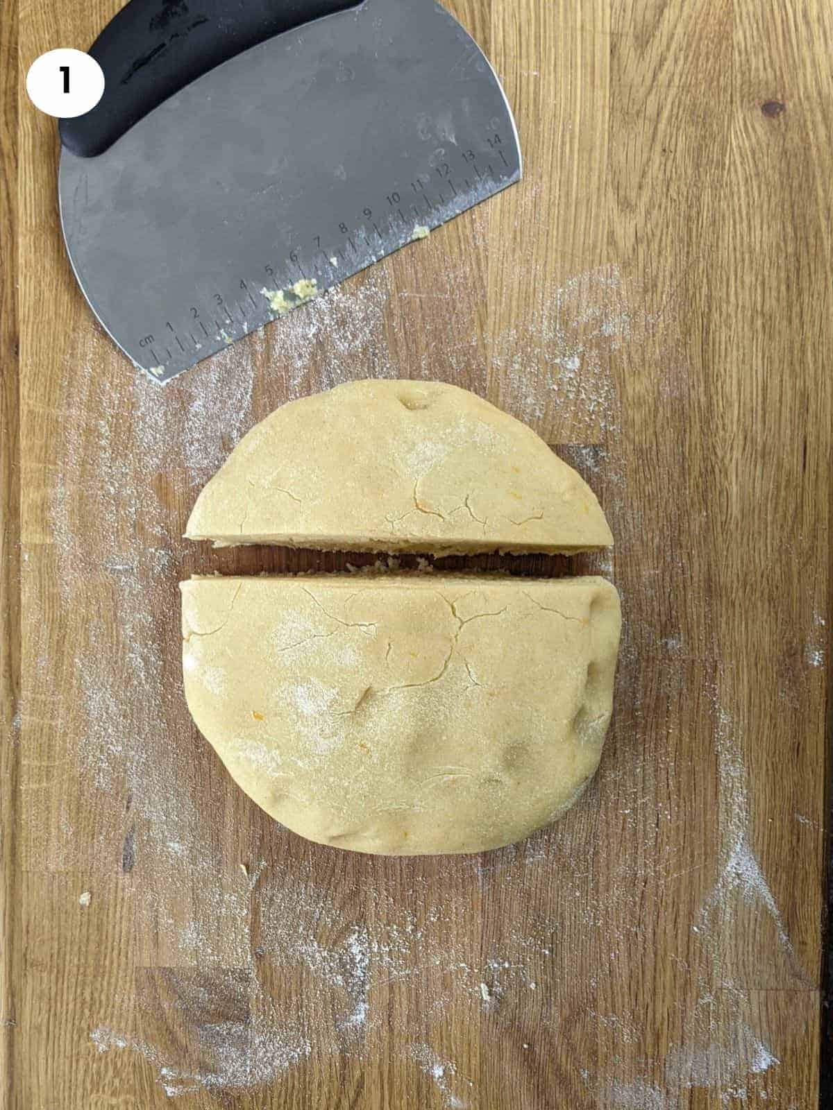 Cutting the dough into two pieces.