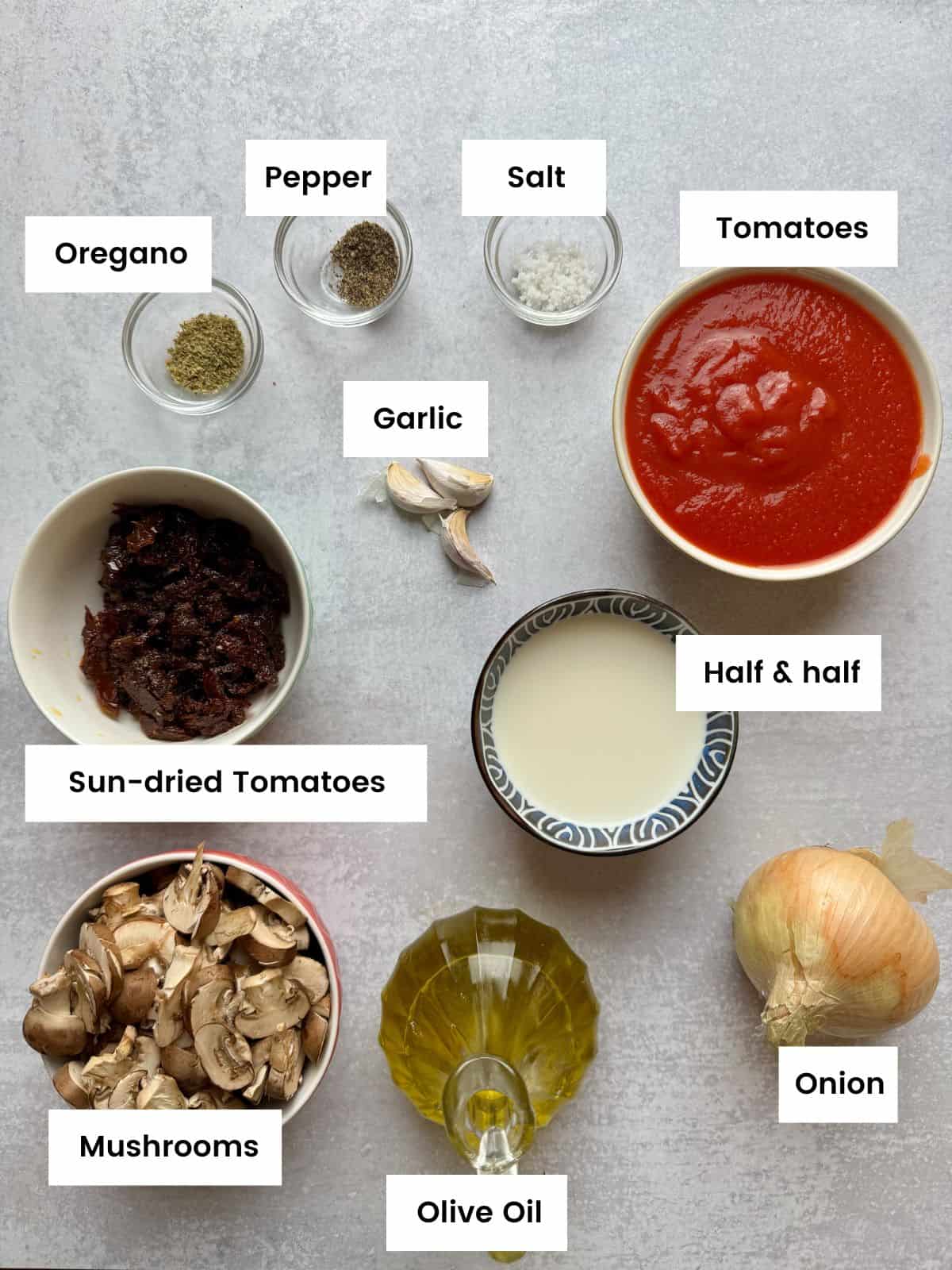 Ingredients for sun-dried tomatoes and mushrooms tomato sauce.