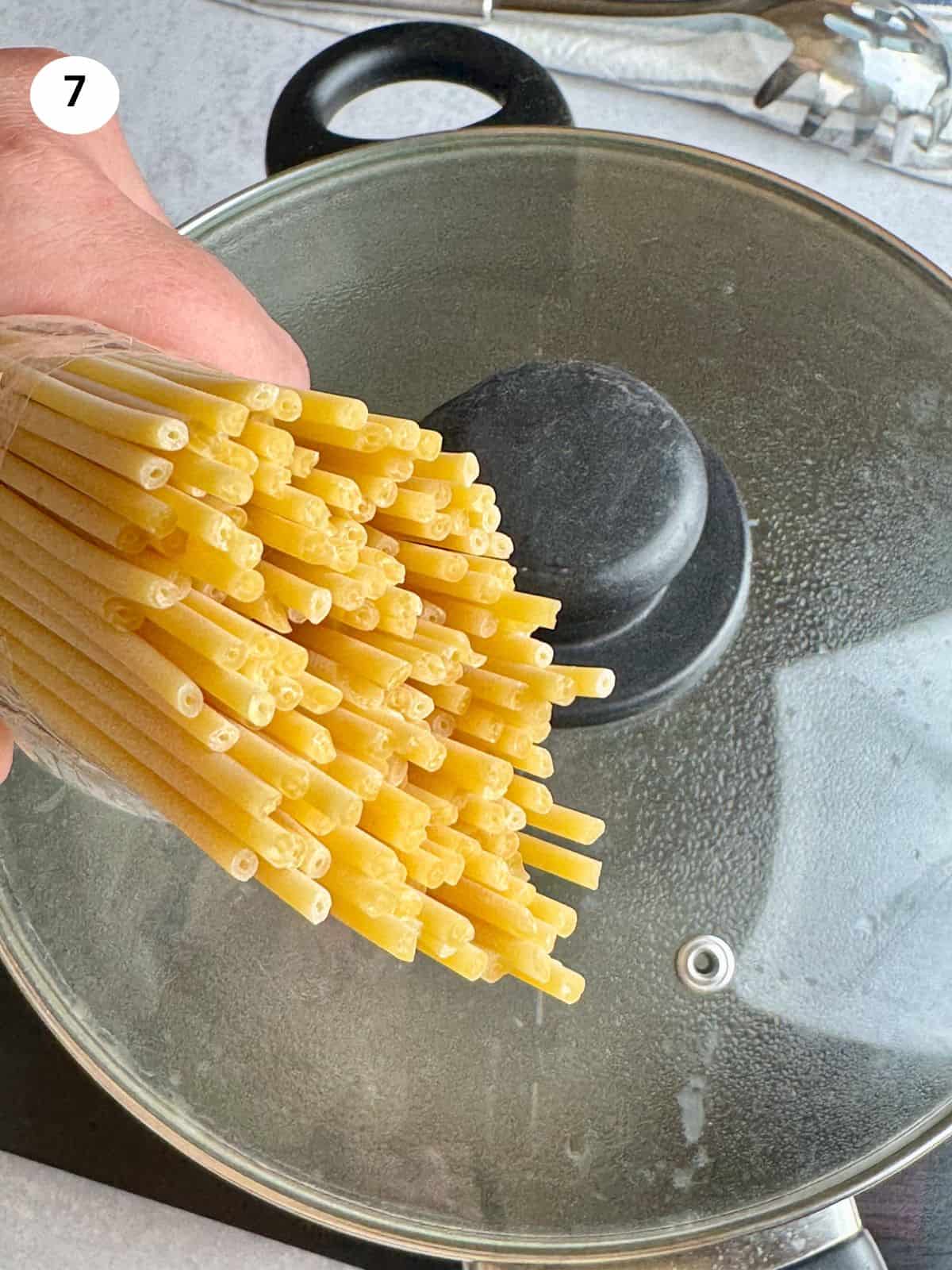 Showing the buccatini pasta before adding to boiling water.
