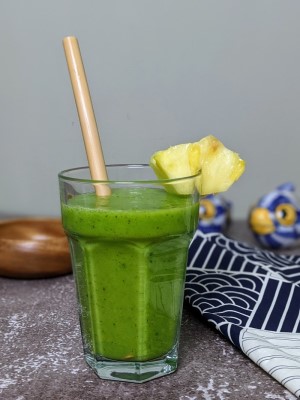 Pineapple & Kiwi & Spinach Smoothie served in a glass