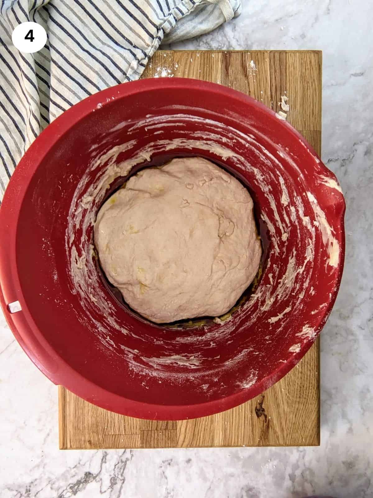 Dough in a bowl ready to rest for an hour