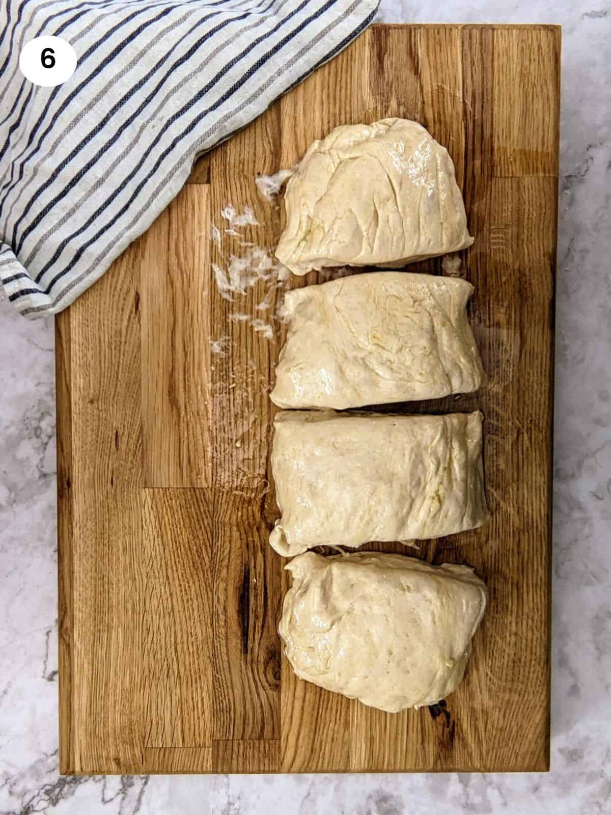 Dough for pita bread in a long roll.