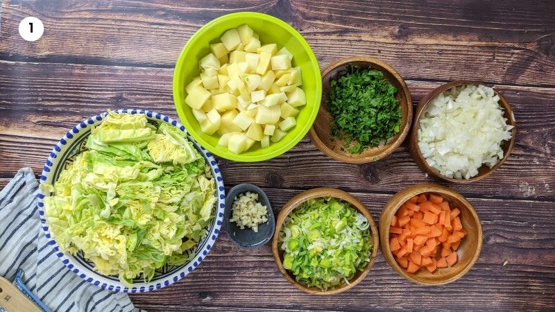 Chopped vegetables in preparation fo cabbage and pork stew.