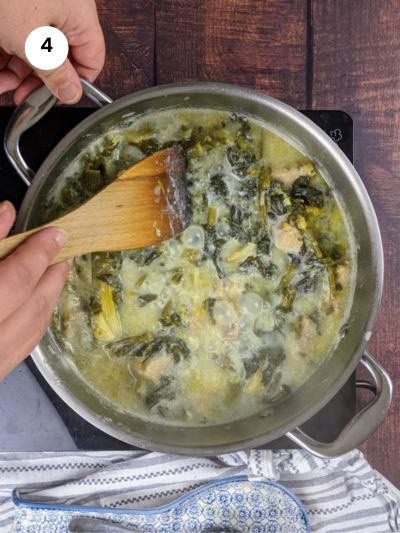 Adding the avgolemono back to the pot with the pork and celery stew.