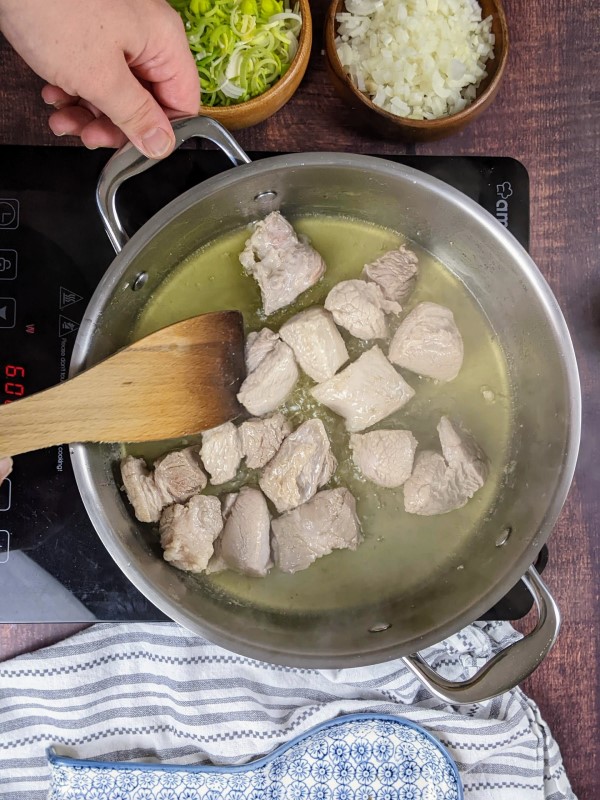 Browning the pork before adding the rest of the ingredients.