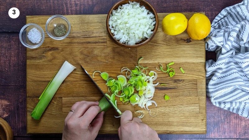 Cutting the leek in preparation for the stew.