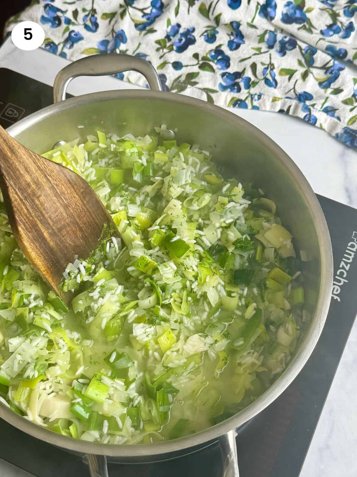 Stirring after adding lemon juice and fresh dill.
