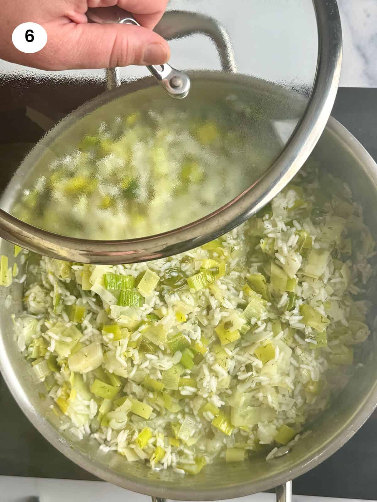 Covering pot with lid after turning heat off.