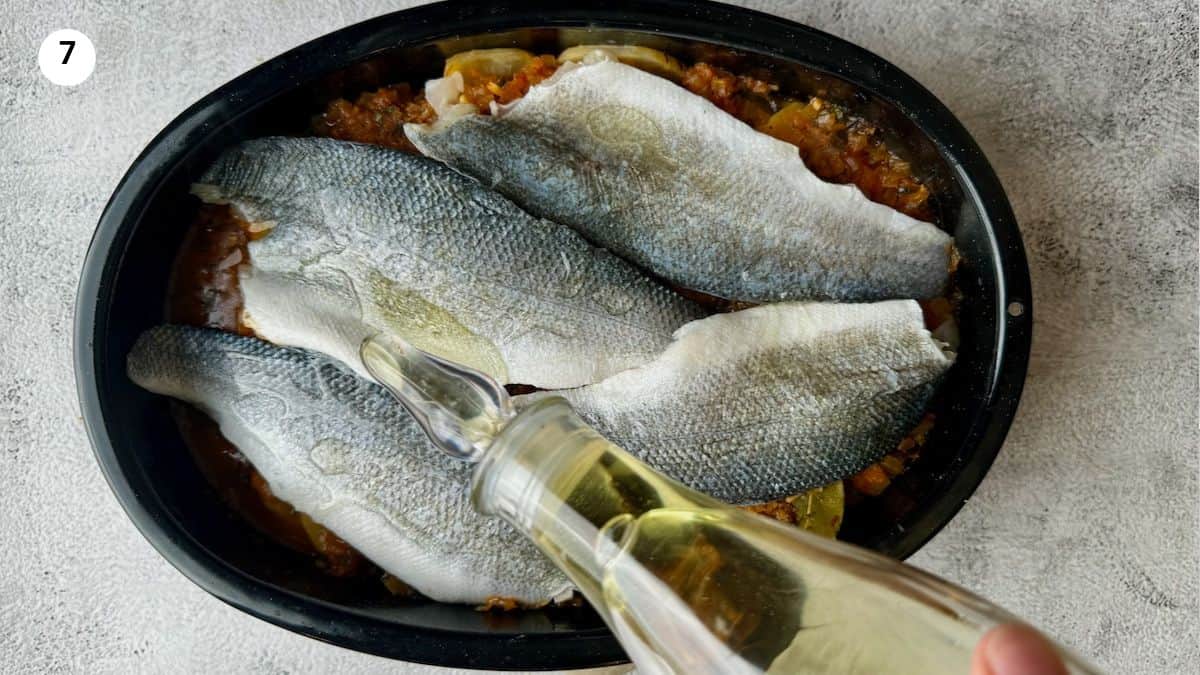 Adding the fish on top of the potatoes.