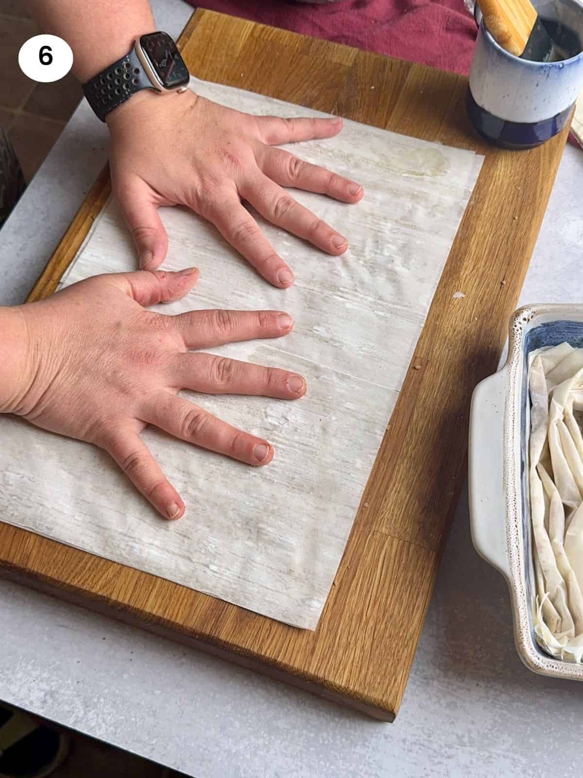 Covering with another phyllo sheet.