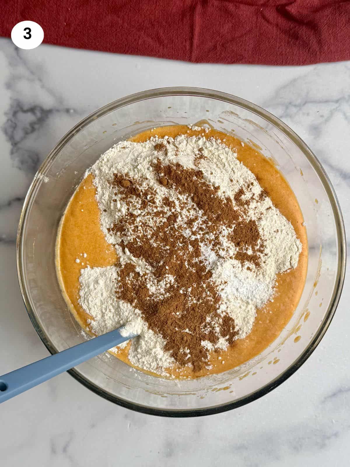 Added dry ingredients to the batter.