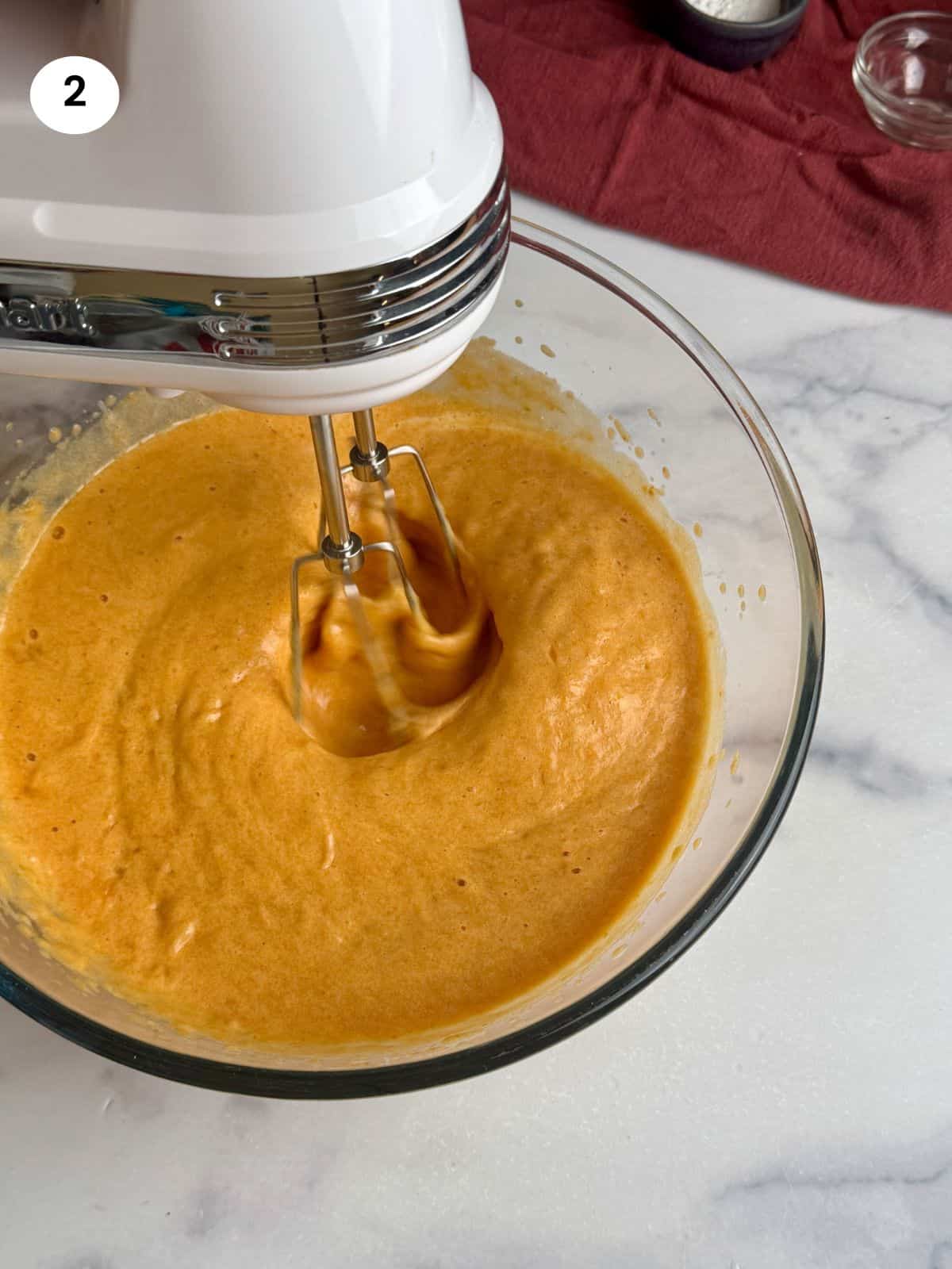 Mixing the remaining wet ingredients with a mixer.