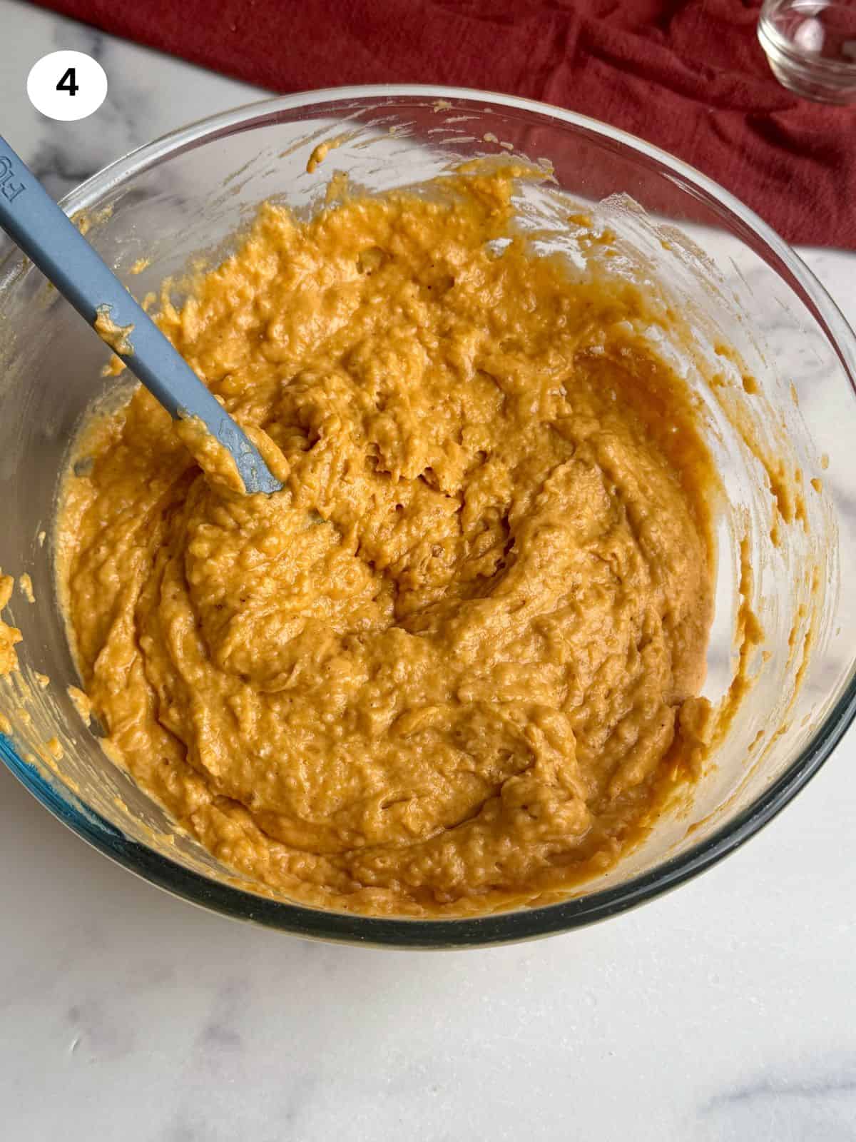 Mixed batter in a glass bowl.