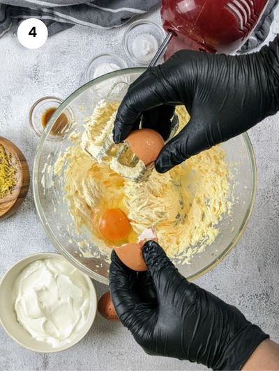 Adding the eggs to the batter.