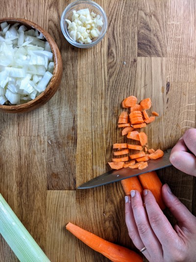 Chopping the carrots into slices