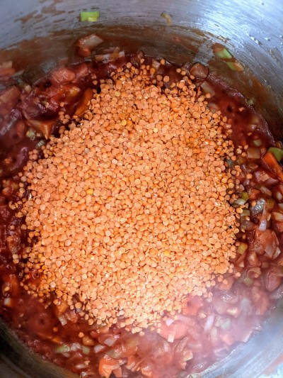 Red lentils added to the pot.