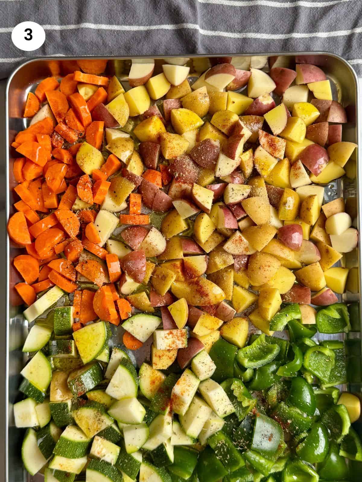Chopped vegetables in a baking tray.