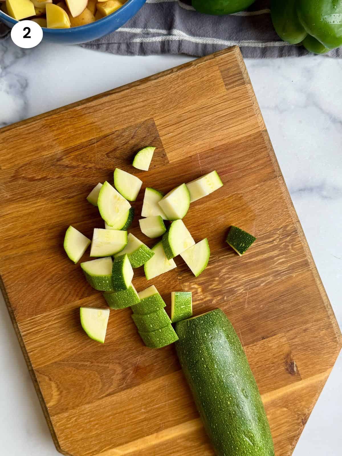 Zucchini slices cut into quarters.