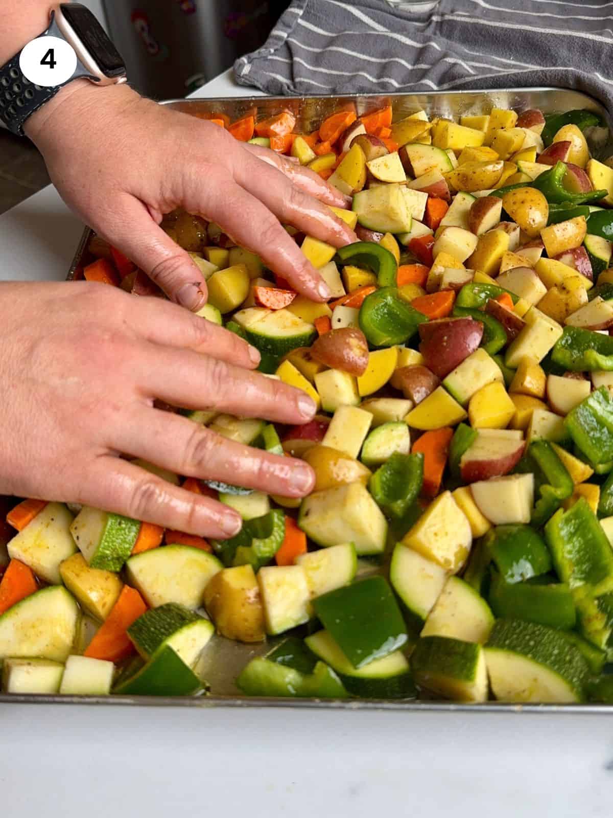 Mixing the veggies with the seasoning.