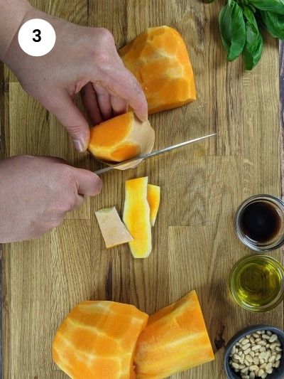 Removing the skin from the butternut squash.