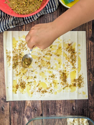 Spread baklava filling on the filo pastry.