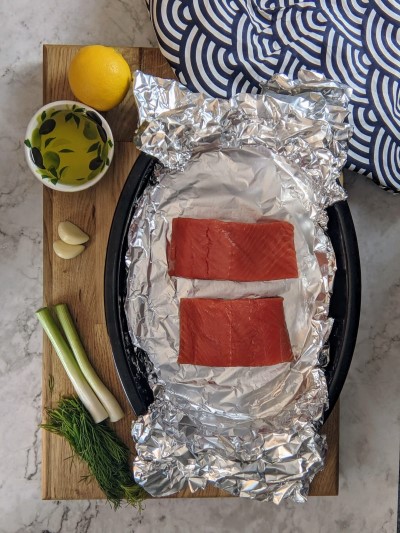Salmon fillets placed on foil