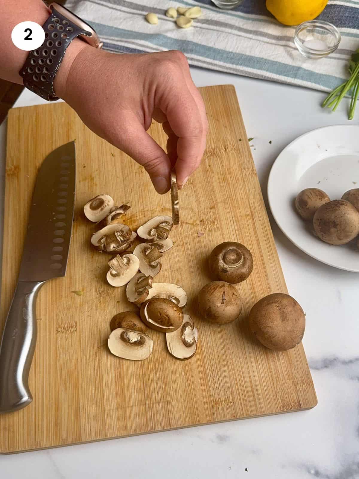 Cutting the mushrooms into slices.