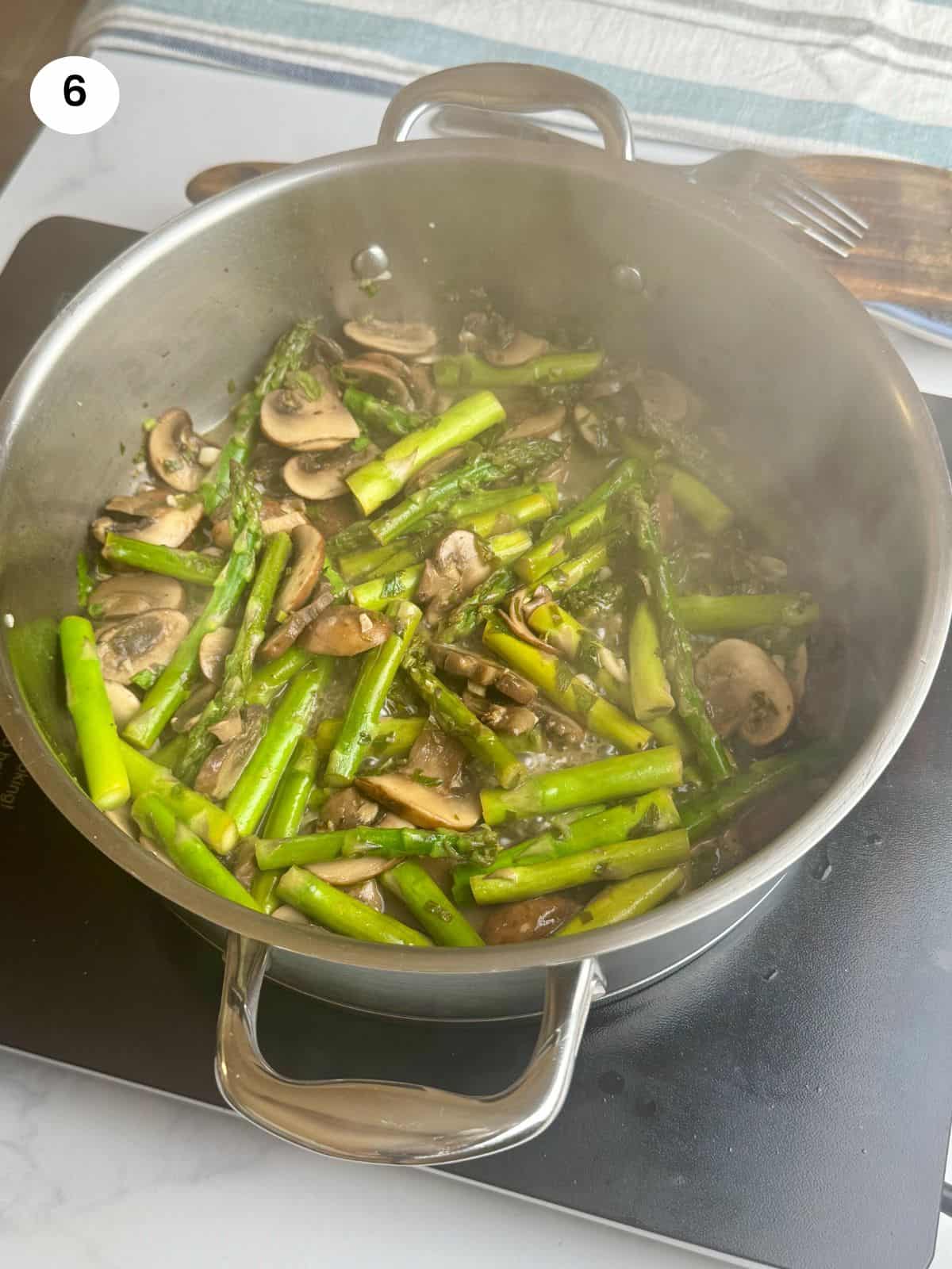 Sauteing all the veggies until fork tender.